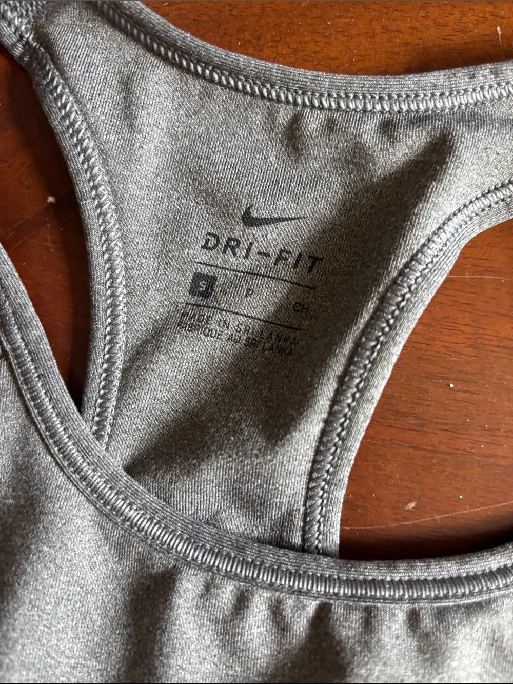 2 Nike and 1 pink Victoria’s Secret Gray Dri-FIT Racerback Sports Bra